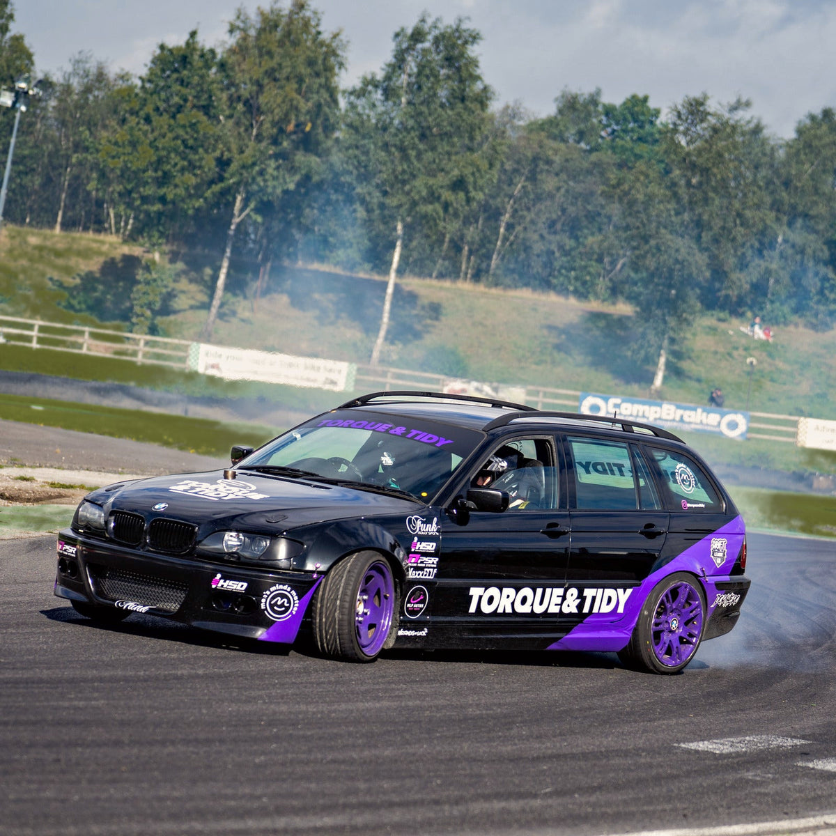 The Torque & Tidy drift car mid-drift with tyre smoke