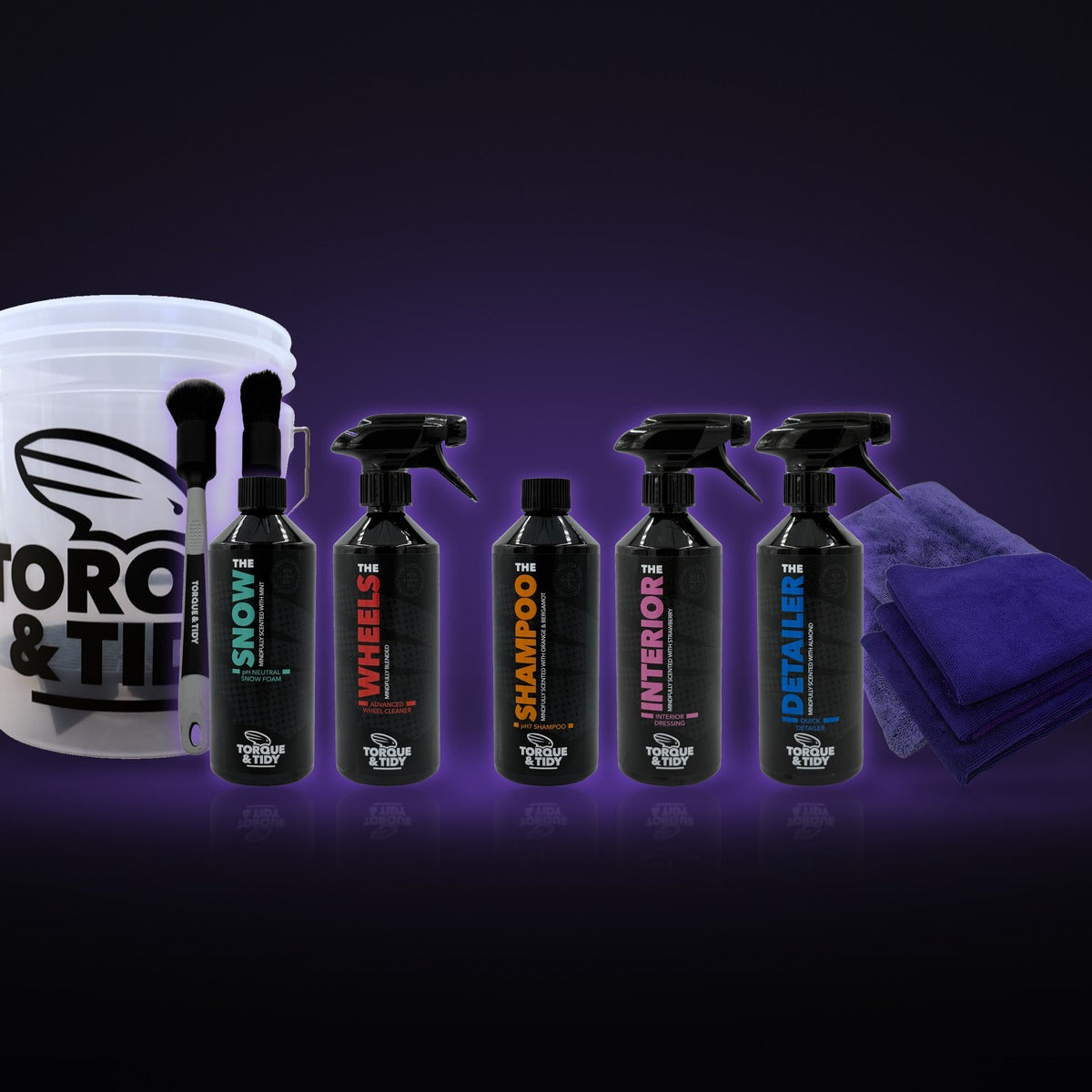 The Starter Bundle: wash bucket, brushes, cloths and bottles on a dark purple background