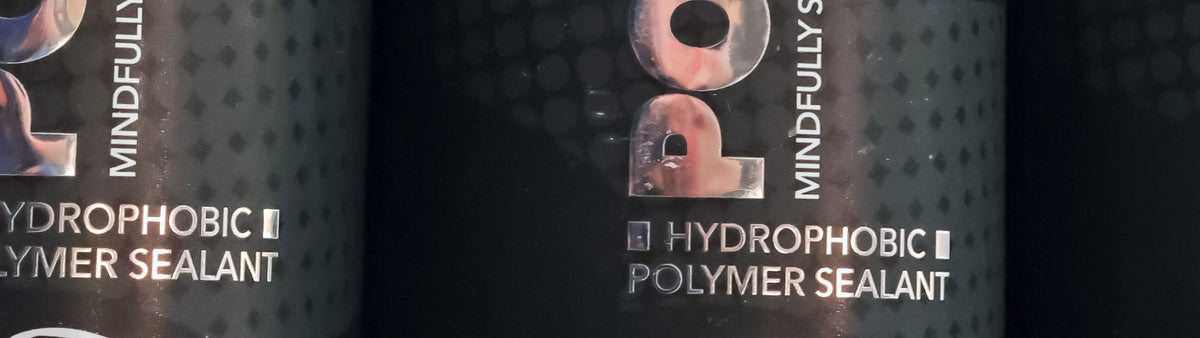 The Polyseal bottles, Hydrophobic Polymer Sealant label, on the Torque & Tidy stand