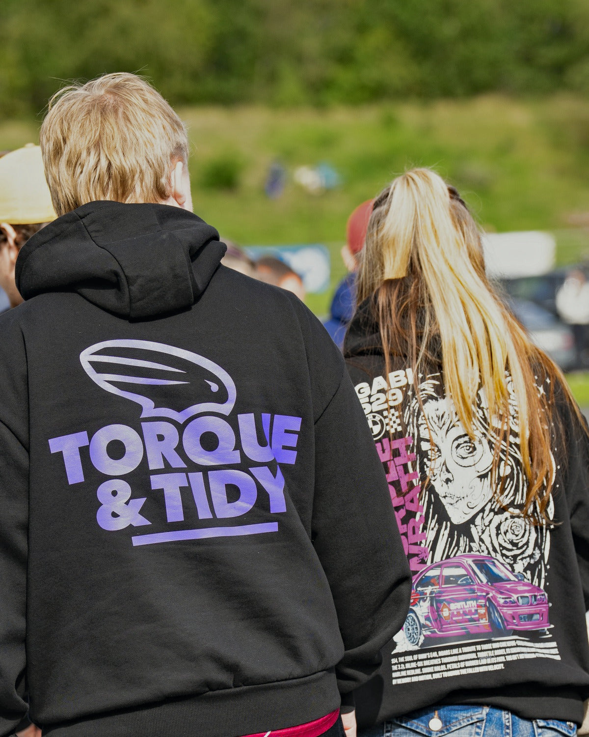 Torque & Tidy hoodie, purple back print, worn at the track