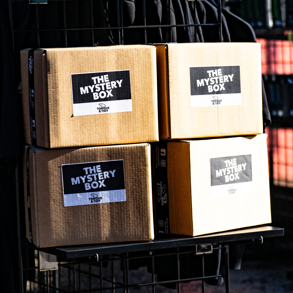 Torque & Tidy Mystery Boxes: brown cardboard boxes with The Mystery Box label and black branded tape