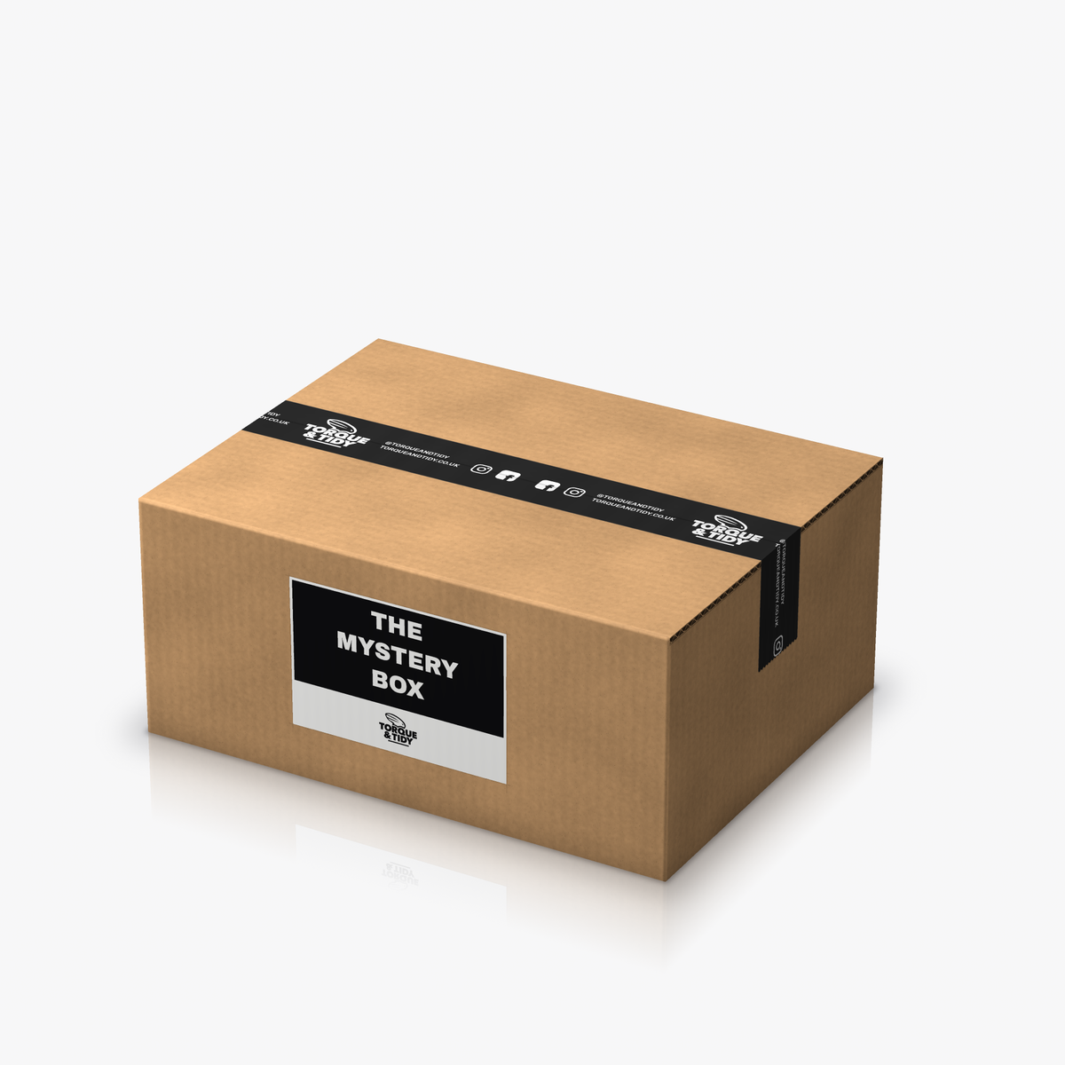 The Mystery Box: a brown cardboard box sealed with black Torque & Tidy tape