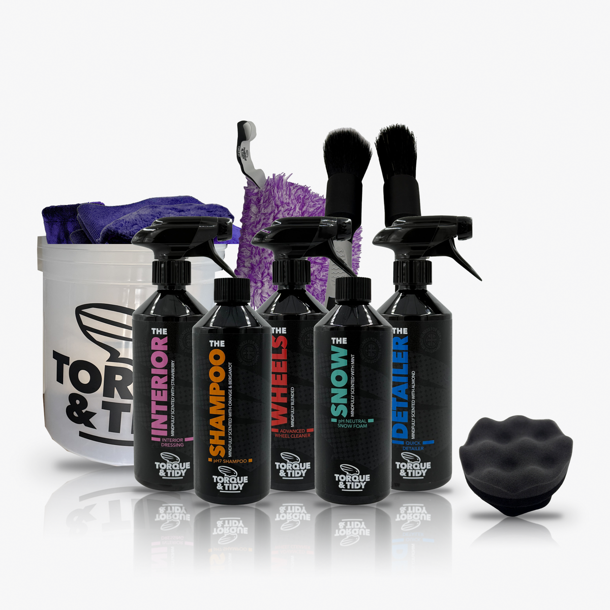 The Starter Bundle in Purple: clear Wash Bucket with purple Dry Towel and GP Cloths, five bottles, brushes, purple wash pad and tyre applicator