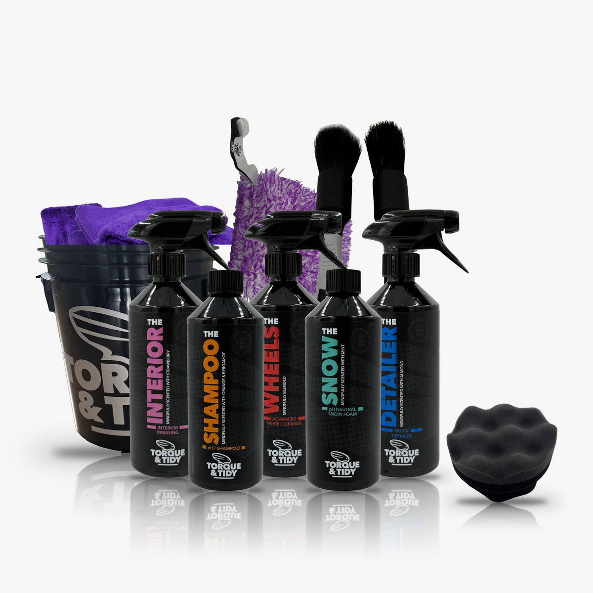 The Starter Bundle in Purple: black Wash Bucket with purple Dry Towel, GP Cloths and wash pad, five bottles, brushes and tyre applicator