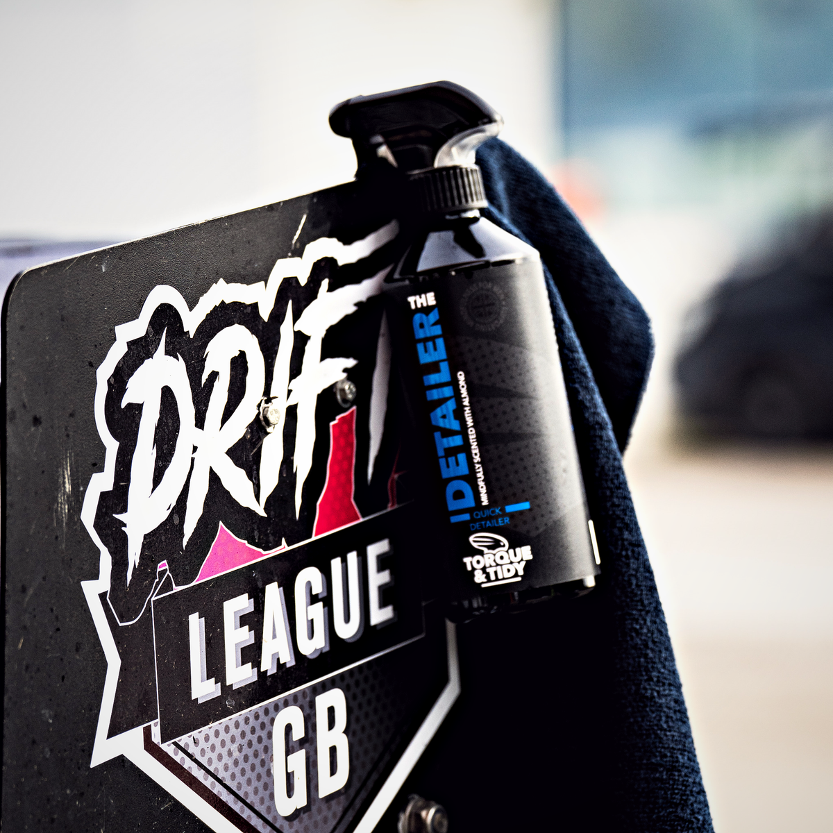 The Detailer hanging on a Drift League GB sign
