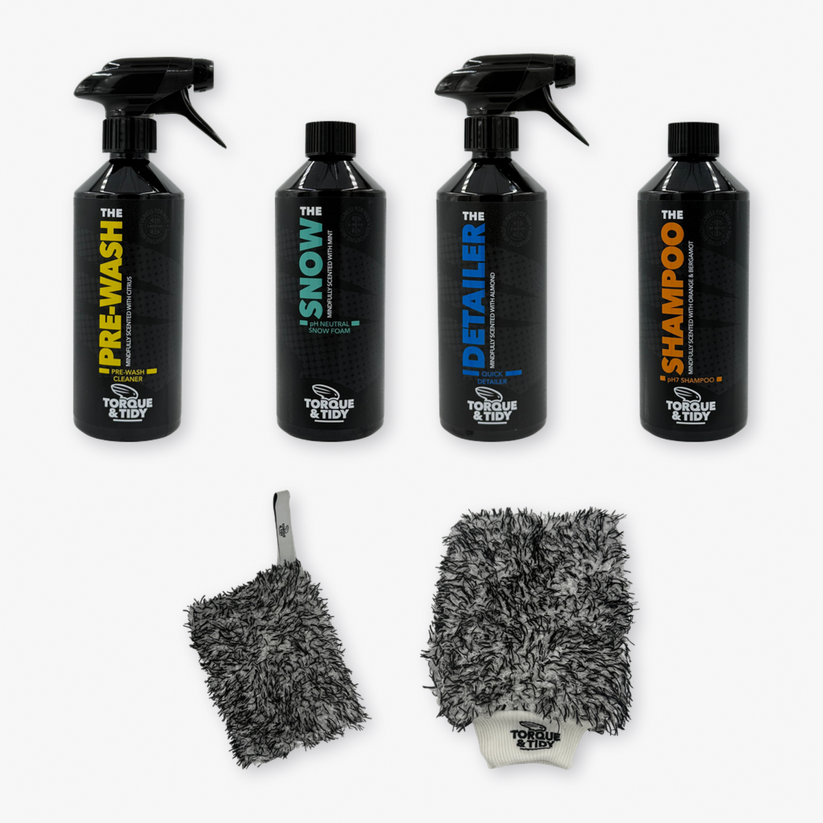 What's inside The Exterior Bundle: Pre-Wash, Snow, Detailer, Shampoo, wash pad and wash mitt laid out