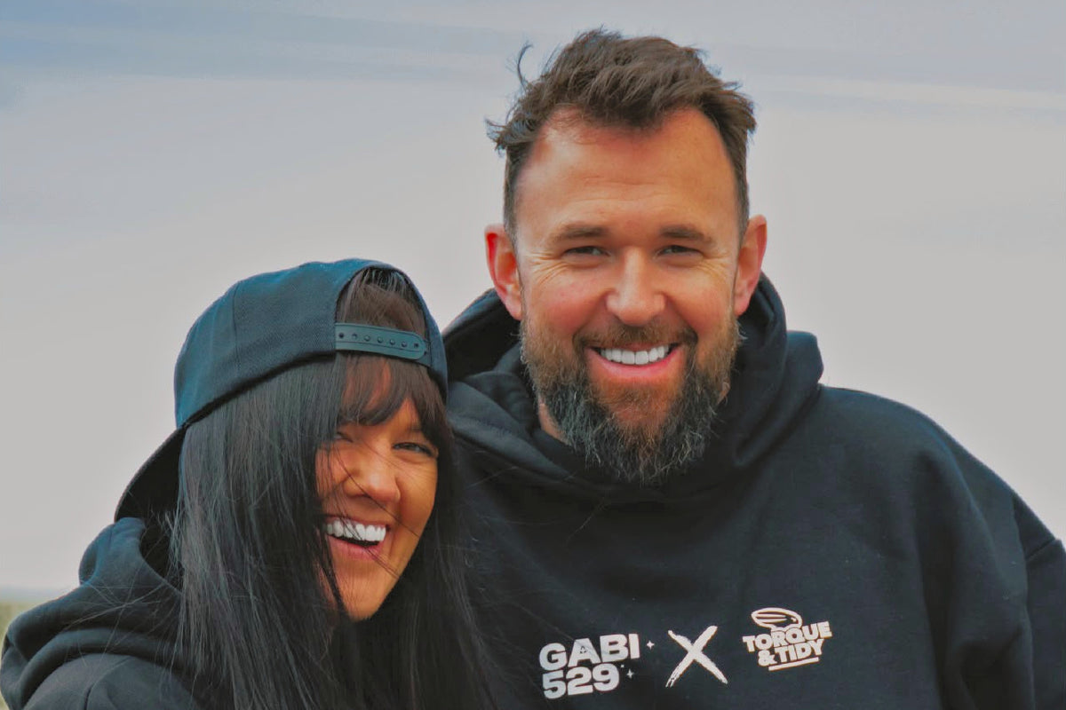 Dan and Dot, who started Torque & Tidy, smiling in T&T hoodies
