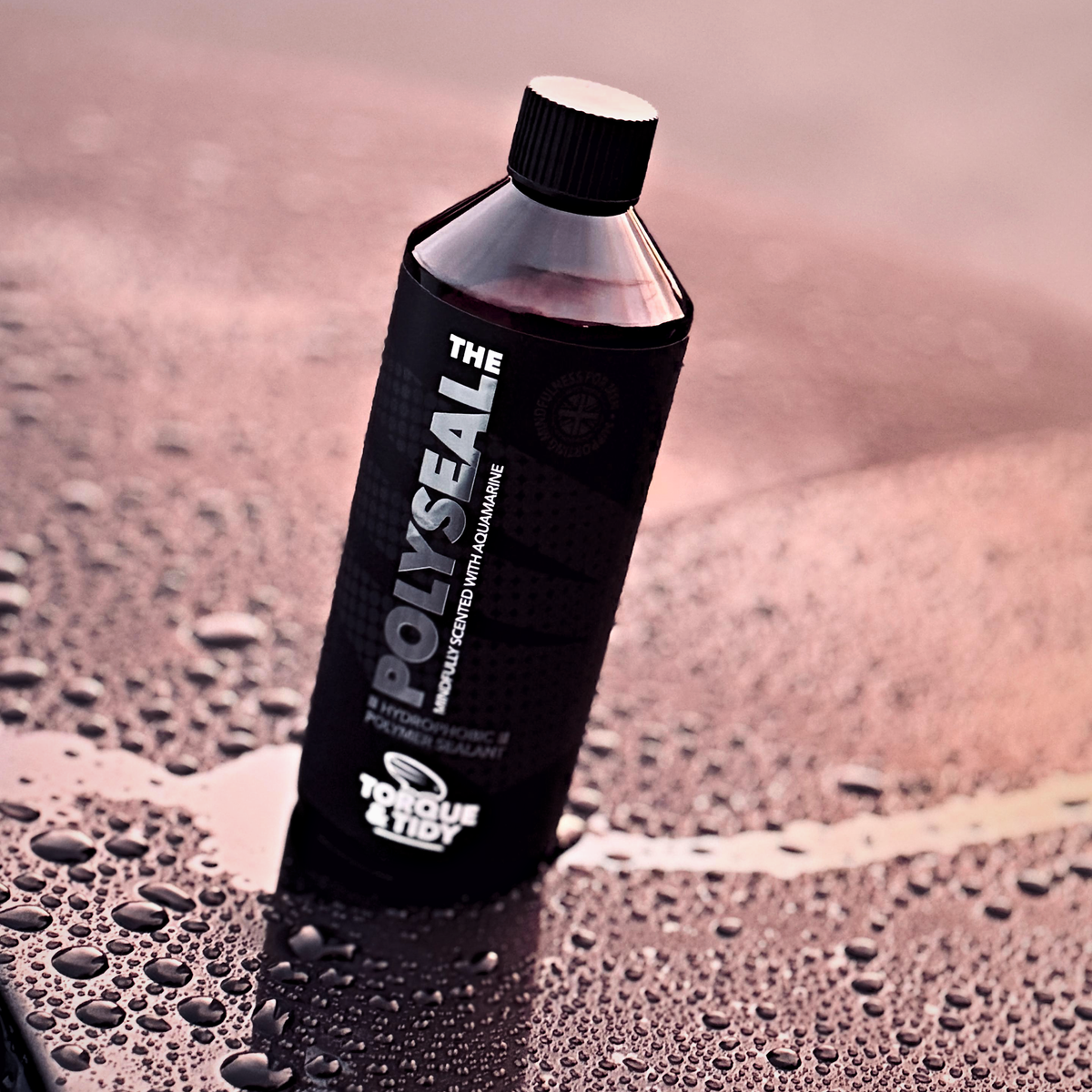 The Polyseal bottle standing in water beads on a car bonnet